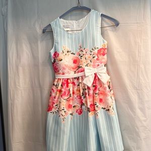 Girls light blue & white striped dress with flowers and bow.Size 10.Fully lined